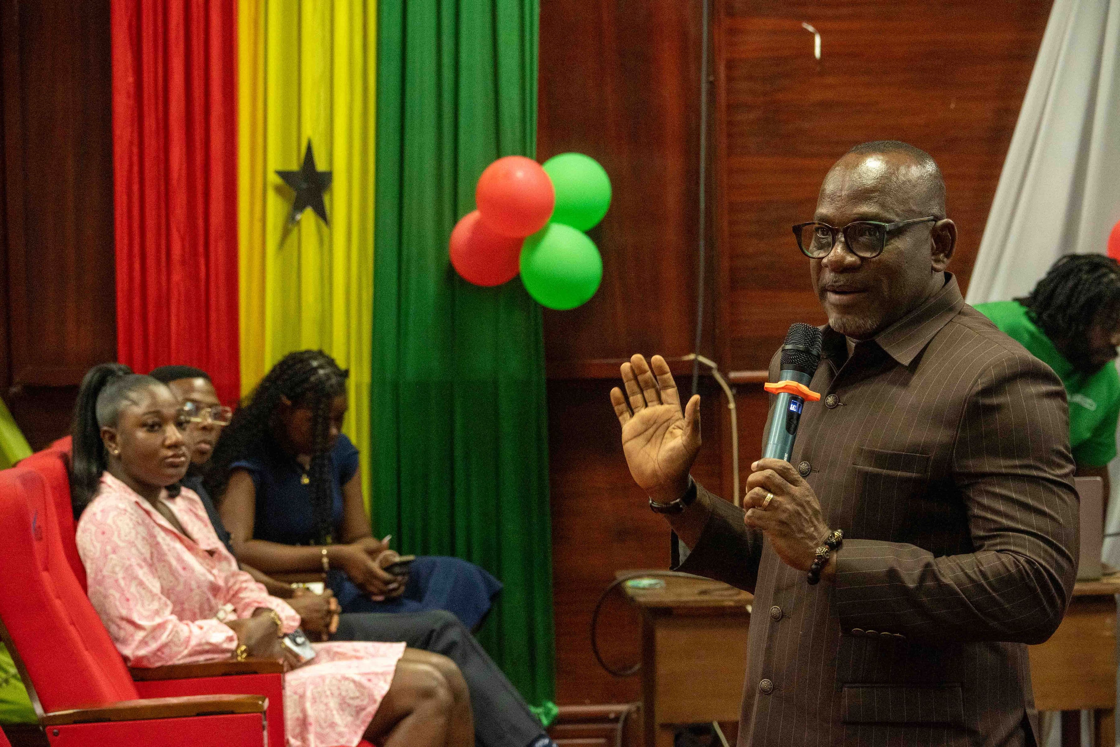 A speaker presenting on stage.